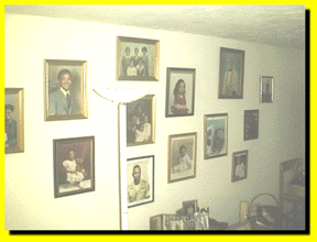 A WALL OF FAMILY MEMBERS PHOTOS