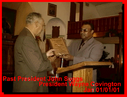 OUT GOING PRESIDENT RECEIVES PLAQUE FROM INCOMING PRESIDENT